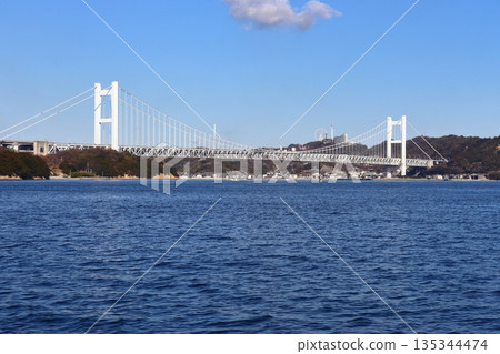 The Seto Ohashi Bridge and Mt. Washu seen from offshore Hitsuishijima The Seto Ohashi Bridge and Mt. Washu seen from offshore Hitsuishijima 135344474