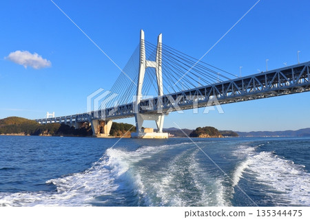 The Seto Ohashi Bridge seen from a boat passing under it, with the view towards Hitsuishijima Island 135344475