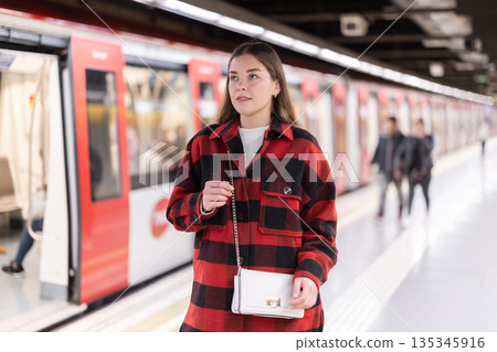 Woman changing to the subway 135345916
