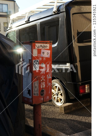 Fire extinguisher box on a street corner 135345921