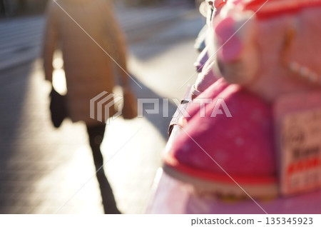Small shoes in a store and a cityscape Small shoes in a store and a cityscape 135345923