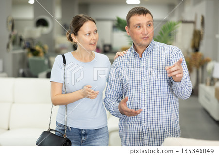 Couple visiting store in search of new furnishings for apartment Couple visiting store in search of new furnishings for apartment 135346049