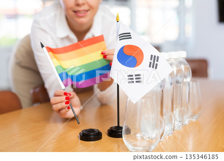Flag of South Korea and rainbow flag of LGBT on negotiating table Flag of South Korea and rainbow flag of LGBT on negotiating table 135346185