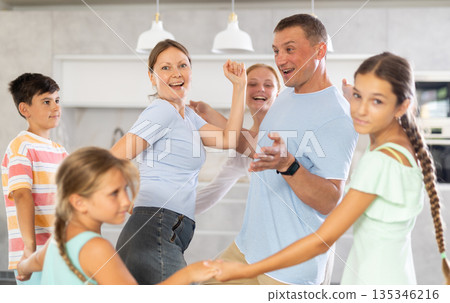 Big family dancing together Big family dancing together 135346216
