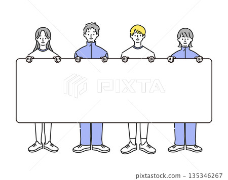 圖：一名身穿運動服和球衣的學生舉著一塊牌子 135346267