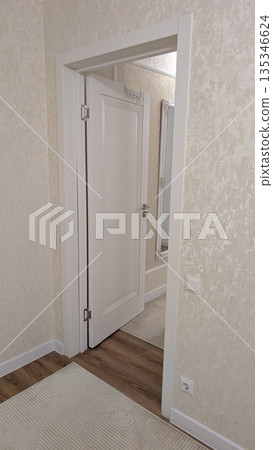 interior doorway framing workspace and corridor for listing photography 135346624