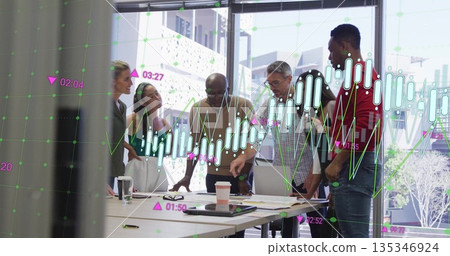 Collaborating colleagues analyzing financial charts in meeting room, with laptop and eyeglasses Collaborating colleagues analyzing financial charts in meeting room, with laptop and eyeglasses 135346924