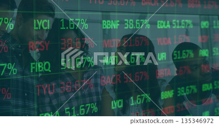 Standing team of four reviewing market data on glass partition in office, projected stock symbols 135346972