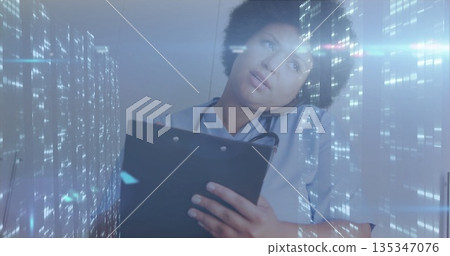 Mid adult nurse with stethoscope calling on smartphone in medical corridor, with cityscape overlay Mid adult nurse with stethoscope calling on smartphone in medical corridor, with cityscape overlay 135347076