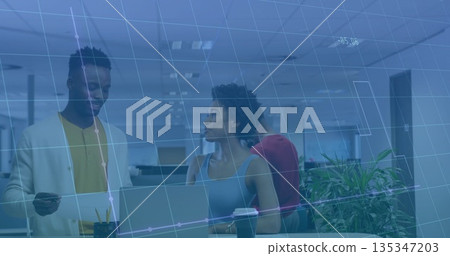 Examining laptop data, three colleagues standing at desk in modern office, with printed document Examining laptop data, three colleagues standing at desk in modern office, with printed document 135347203