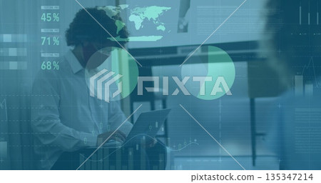 Typing man wearing business attire inputting data on laptop at office desk, with digital overlays Typing man wearing business attire inputting data on laptop at office desk, with digital overlays 135347214