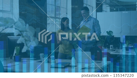 Analyzing floating data charts, two coworkers holding yellow folder and tablet in open plan office Analyzing floating data charts, two coworkers holding yellow folder and tablet in open plan office 135347220