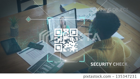 Scanning woman in mustard sweater performing security verification at office, with QR code overlay Scanning woman in mustard sweater performing security verification at office, with QR code overlay 135347231