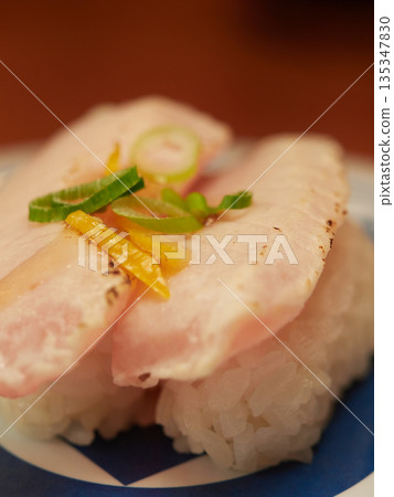 A close-up photo of the restaurant's delicious grilled albacore fatty tuna sushi with yuzu salt A close-up photo of the restaurant's delicious grilled albacore fatty tuna sushi with yuzu salt 135347830