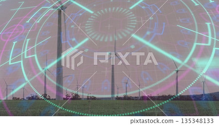 Spinning center white wind turbine standing over grassy field, with digital holographic overlay 135348133