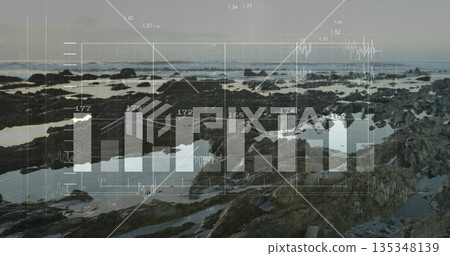 Showing jagged rock formations revealing shallow tide pools at low tide, with digital data overlay 135348139