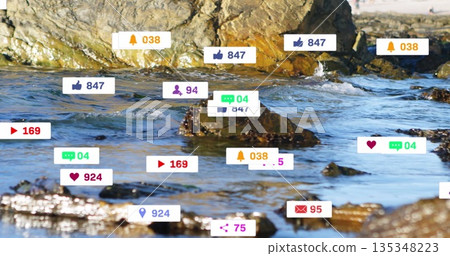 Digital notification icons hovering over rocky shoreline at water's edge, combining nature and tech Digital notification icons hovering over rocky shoreline at water's edge, combining nature and tech 135348223