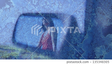 Reflecting Indian woman wearing red swimsuit on boat hull chipped blue-painted panel, with mirror Reflecting Indian woman wearing red swimsuit on boat hull chipped blue-painted panel, with mirror 135348305