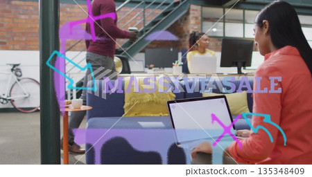 Typing woman in red blazer using laptop on sofa at office with sale overlay, copy space 135348409