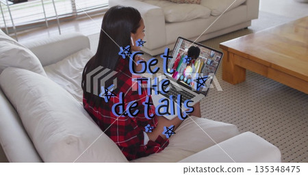 Woman in plaid shirt typing on laptop on sofa in living room, wireless earbuds, copy space Woman in plaid shirt typing on laptop on sofa in living room, wireless earbuds, copy space 135348475