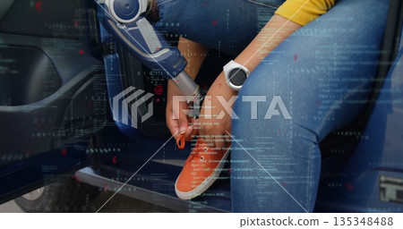 Woman with prosthetic limb adjusting laces in compact car doorway, with AR graphics 135348488