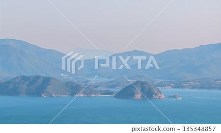 Serene Coastal Mountain Range Over Port Shelter Serene Coastal Mountain Range Over Port Shelter 135348857