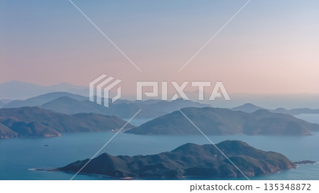 Serene Coastal Mountain Range Over Port Shelter Serene Coastal Mountain Range Over Port Shelter 135348872