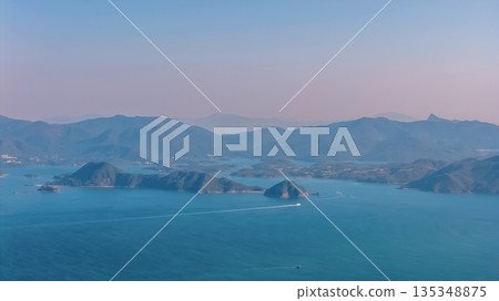 Serene Coastal Mountain Range Over Port Shelter 135348875