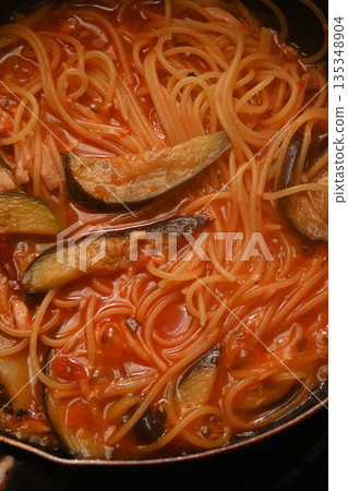 Cooking eggplant and tuna pasta in tomato sauce Cooking eggplant and tuna pasta in tomato sauce 135348904