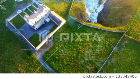 Showing walled compound perched on cliff, with white two-story house, paved drive and ocean waves Showing walled compound perched on cliff, with white two-story house, paved drive and ocean waves 135349406
