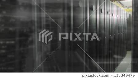 Server rack cabinets lining data center aisle, housing LEDs and cable trays, copy space 135349479