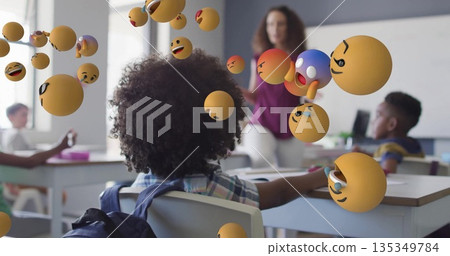 Plaid shirt student watching teacher gesturing at whiteboard in class, with floating 3D emojis Plaid shirt student watching teacher gesturing at whiteboard in class, with floating 3D emojis 135349784