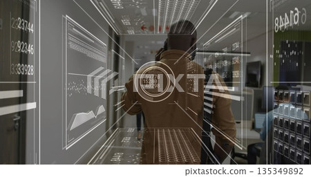 Talking man in brown jacket holding smartphone in tech office corridor, with floating data panels Talking man in brown jacket holding smartphone in tech office corridor, with floating data panels 135349892