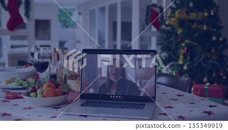 Displaying surprised woman on laptop screen during holiday meal with fruit bowl and Christmas tree Displaying surprised woman on laptop screen during holiday meal with fruit bowl and Christmas tree 135349919