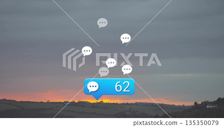 Floating chat bubble icons drifting over fields at sunset, with blue notification badge showing 62 Floating chat bubble icons drifting over fields at sunset, with blue notification badge showing 62 135350079