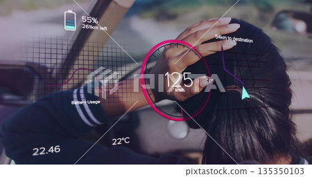 Adjusting hair Indian woman driving on highway with AR display showing 125 km or h speed, copy space 135350103