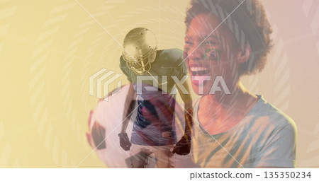 Cheering female fan wearing t-shirt in studio, with football, helmet, jersey and gloves, copy space 135350234