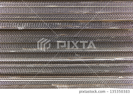 Side view of stacked cardboard boxes 135350383