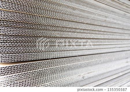 Side view of stacked cardboard boxes 135350387