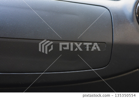 Airbag panel showing safety feature in a vehicle interior design 135350554