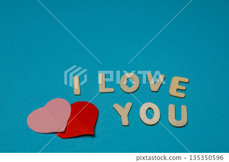 Words and hearts on a blue background expressing love and affection Words and hearts on a blue background expressing love and affection 135350596