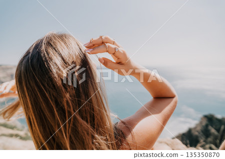 Woman with Long Brown Hair Looking at the View Woman with Long Brown Hair Looking at the View 135350870