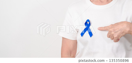 Elderly with dark Blue or Navy blue Ribbon for concept of March Colorectal and Colon Cancer Awareness month, May Arthritis awareness, July Juvenile arthritis and Childhood. Health and world cancer day Elderly with dark Blue or Navy blue Ribbon for concept of March Colorectal and Colon Cancer Awareness month, May Arthritis awareness, July Juvenile arthritis and Childhood. Health and world cancer day 135350896