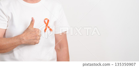 Elderly with Orange Ribbon for September Leukemia, March Kidney cancer day, Multiple Sclerosis, Self Injury Awareness month, November Complex Regional Pain Syndrome, CRPS, COPD disease concept 135350907