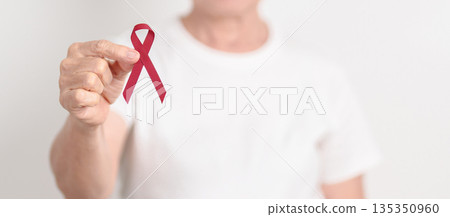 Elderly with Burgundy Ribbon for March Multiple Myeloma Cancer Awareness month, September Sickle Cell Anemia, Headache and Migraine week, April world Meningitis day, October Hospice  Palliative care 135350960