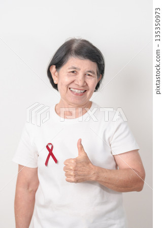 Elderly with Burgundy Ribbon for March Multiple Myeloma Cancer Awareness month, September Sickle Cell Anemia, Headache and Migraine week, April world Meningitis day, October Hospice  Palliative care 135350973