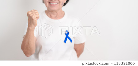 Elderly with dark Blue or Navy blue Ribbon for concept of March Colorectal and Colon Cancer Awareness month, May Arthritis awareness, July Juvenile arthritis and Childhood. Health and world cancer day Elderly with dark Blue or Navy blue Ribbon for concept of March Colorectal and Colon Cancer Awareness month, May Arthritis awareness, July Juvenile arthritis and Childhood. Health and world cancer day 135351000