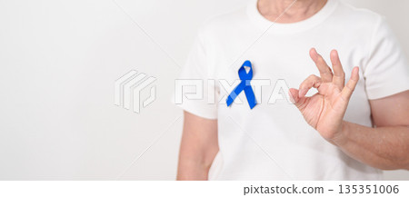 Elderly with dark Blue or Navy blue Ribbon for concept of March Colorectal and Colon Cancer Awareness month, May Arthritis awareness, July Juvenile arthritis and Childhood. Health and world cancer day Elderly with dark Blue or Navy blue Ribbon for concept of March Colorectal and Colon Cancer Awareness month, May Arthritis awareness, July Juvenile arthritis and Childhood. Health and world cancer day 135351006