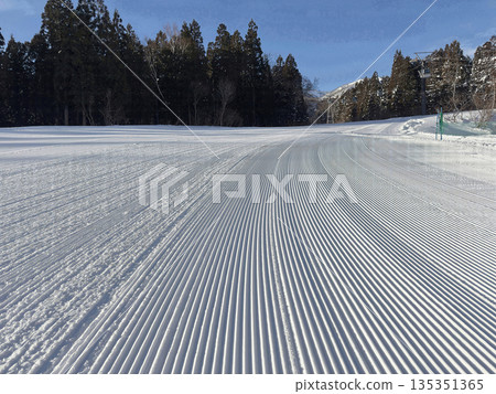 Traces of a ski resort snow groomer, Catapura Pisten 135351365
