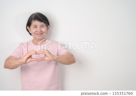 Elderly woman with pink Shirt for Pink October Breast Cancer Awareness month, May Women Health, women rights, Empowerment, March International Women day, February Valentine, May International Mother 135351760
